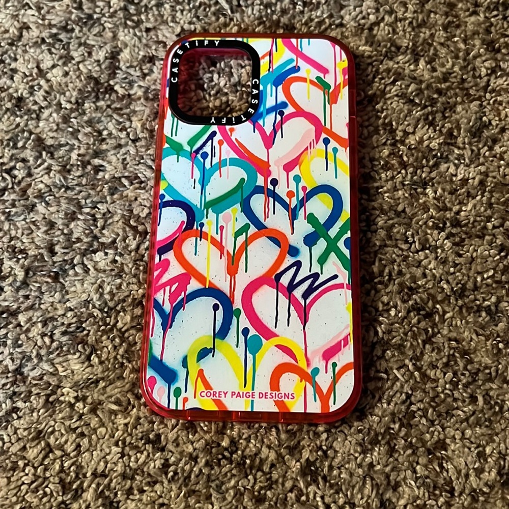 Newly used neon heart hard shell iPhone 12 Pro case.